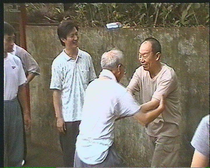 Chen Wei Bu watching as Bill and Joseph tussle